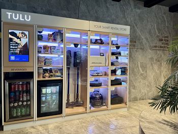 a refrigerated display case in the lobby of a tulu store